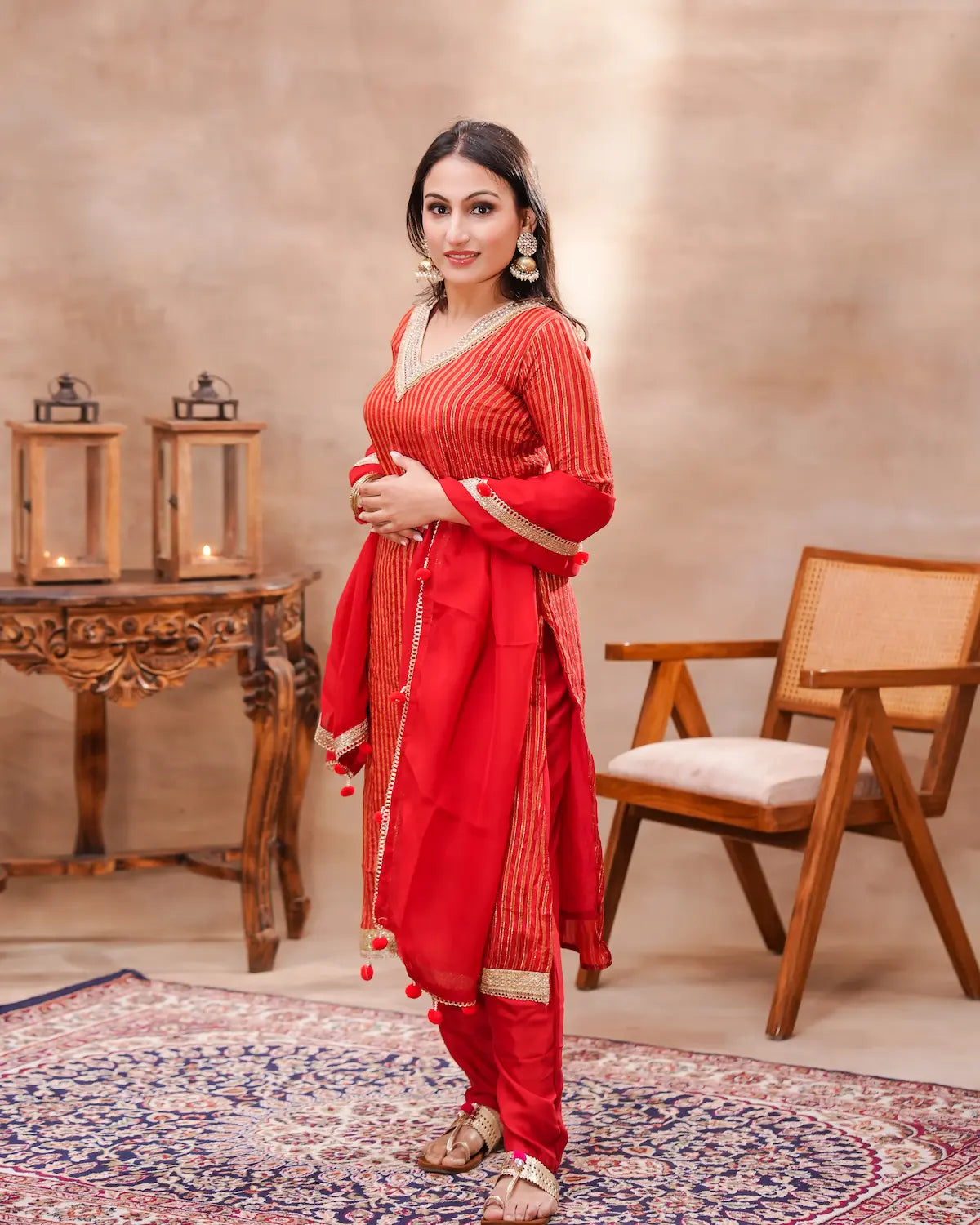 Red silk kurta set with matching dupatta by Shuchi Man, featuring elegant embroidery and a graceful silhouette.